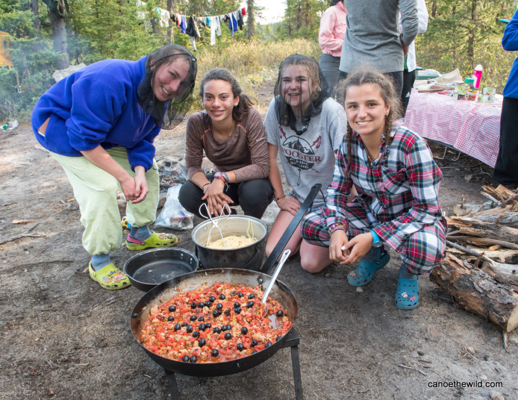 Campers cooking canoe trip meal Canoe the Wild